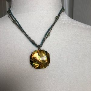 Triple chain necklace w/golden stone